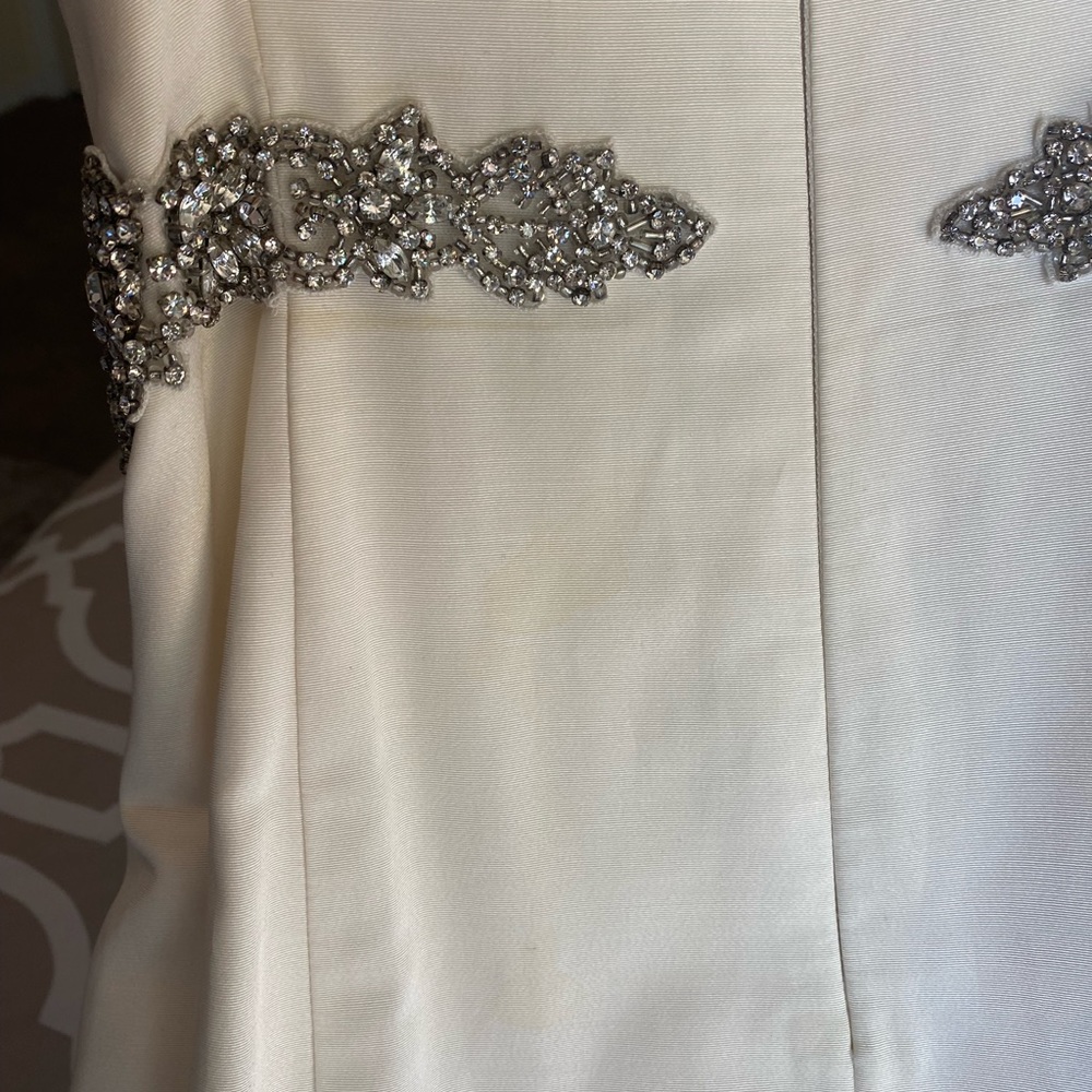 Nicole Miller Wedding Dress with sewn in crystal belt. Style is Dakota. - Picture 5 of 8